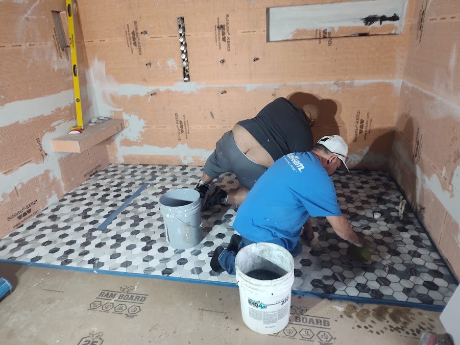 Bathroom tile installation in progress