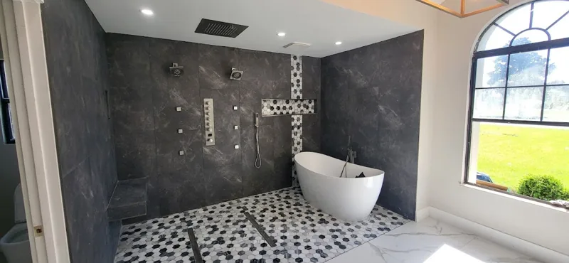 Completed bathroom with freestanding tub and tiled shower